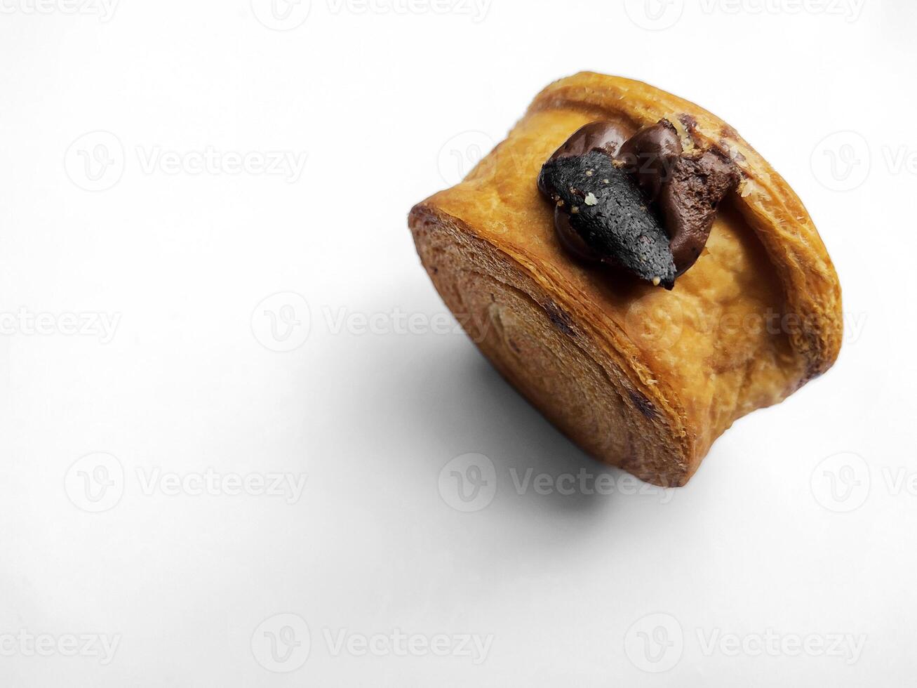 Cromboloni, New York Roll Croissant with chocolate sauce topping, isolated white background. photo