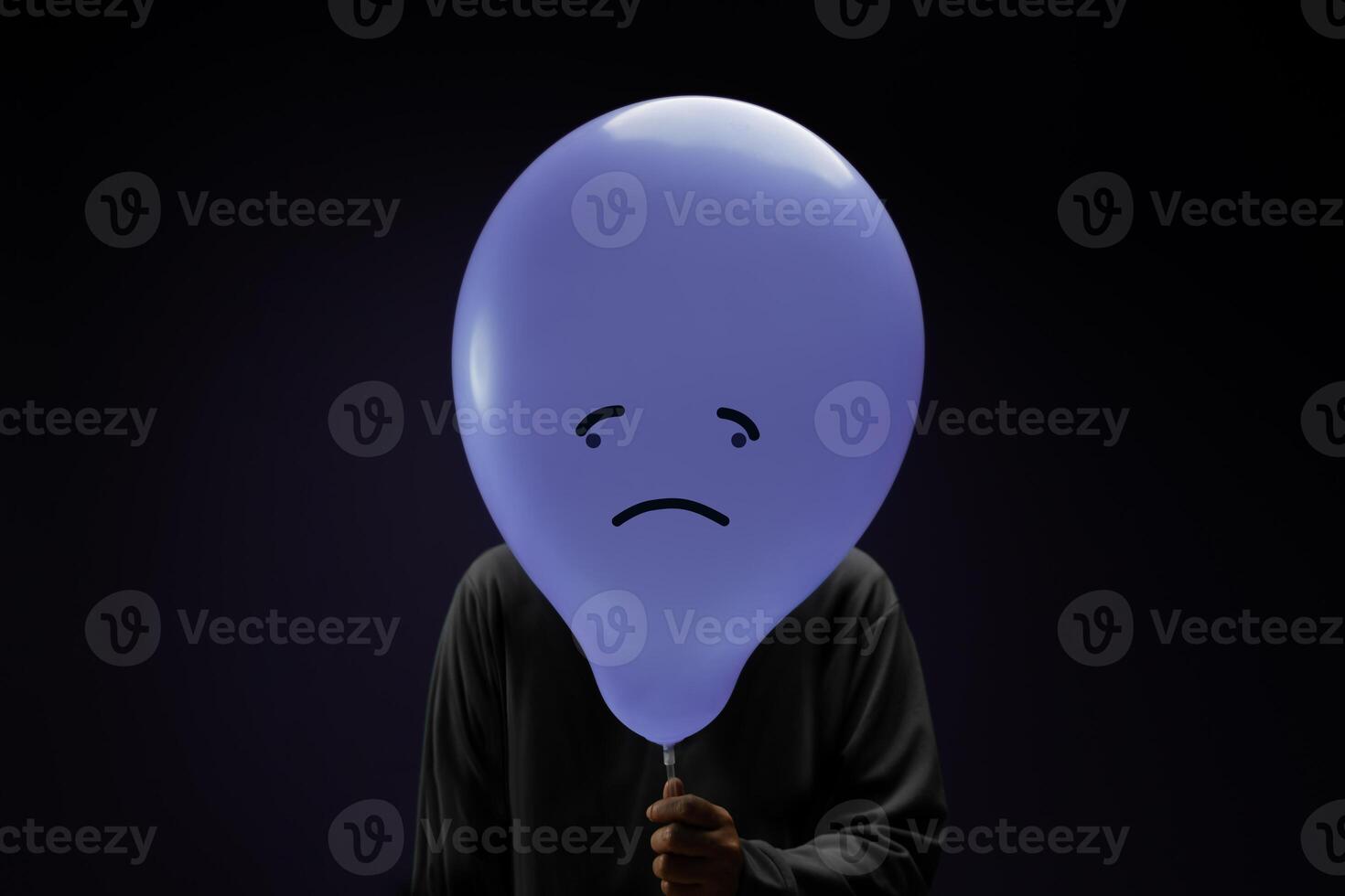 Mental Health Concept. a Stressed, Anxiety, Depressed Person with a Balloon, Negative Emotion and Feeling. Moody. Dark tone photo