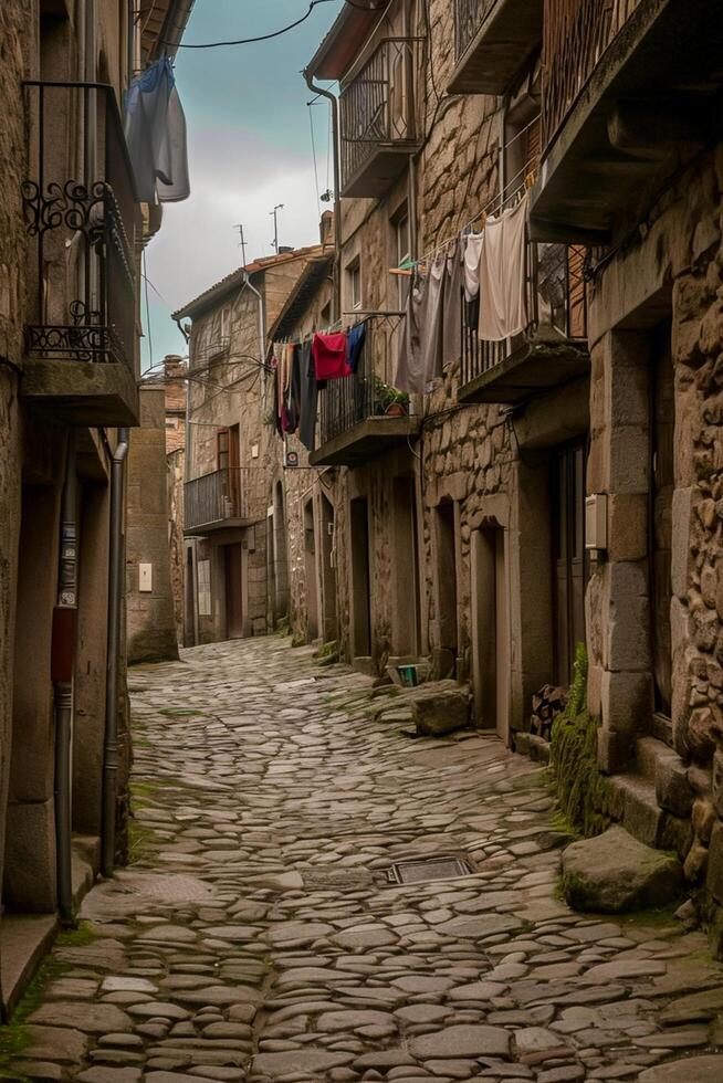 AI generated image captures narrow, cobblestone street lined with old buildings and laundry hanging from the balconies. The sky is overcast, the stone road and buildings Ai Generated photo