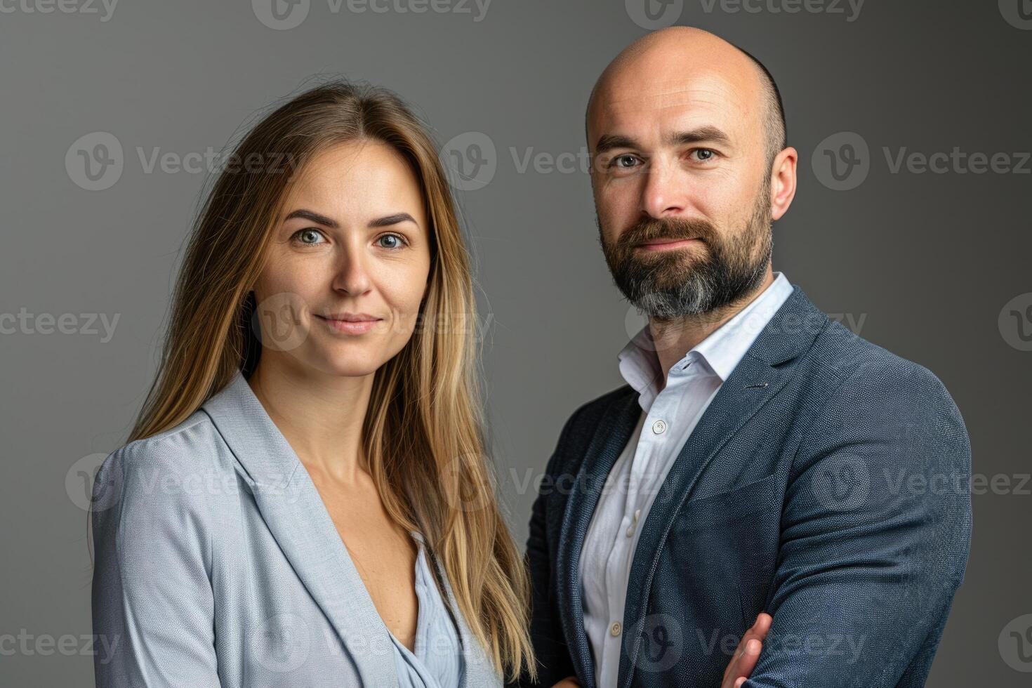 AI generated Business partners posing in front of gray background  looking at camera and smiling. photo