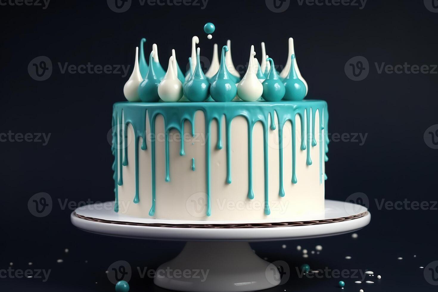 White birthday cake with teal ganache on dark blue background. photo