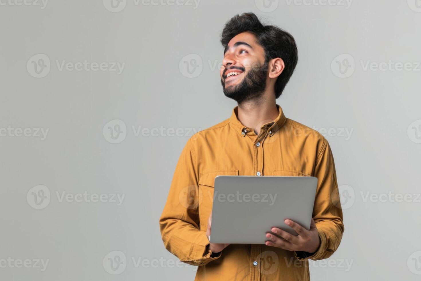 AI generated Smiling young man with laptop  dreaming and thinking. photo