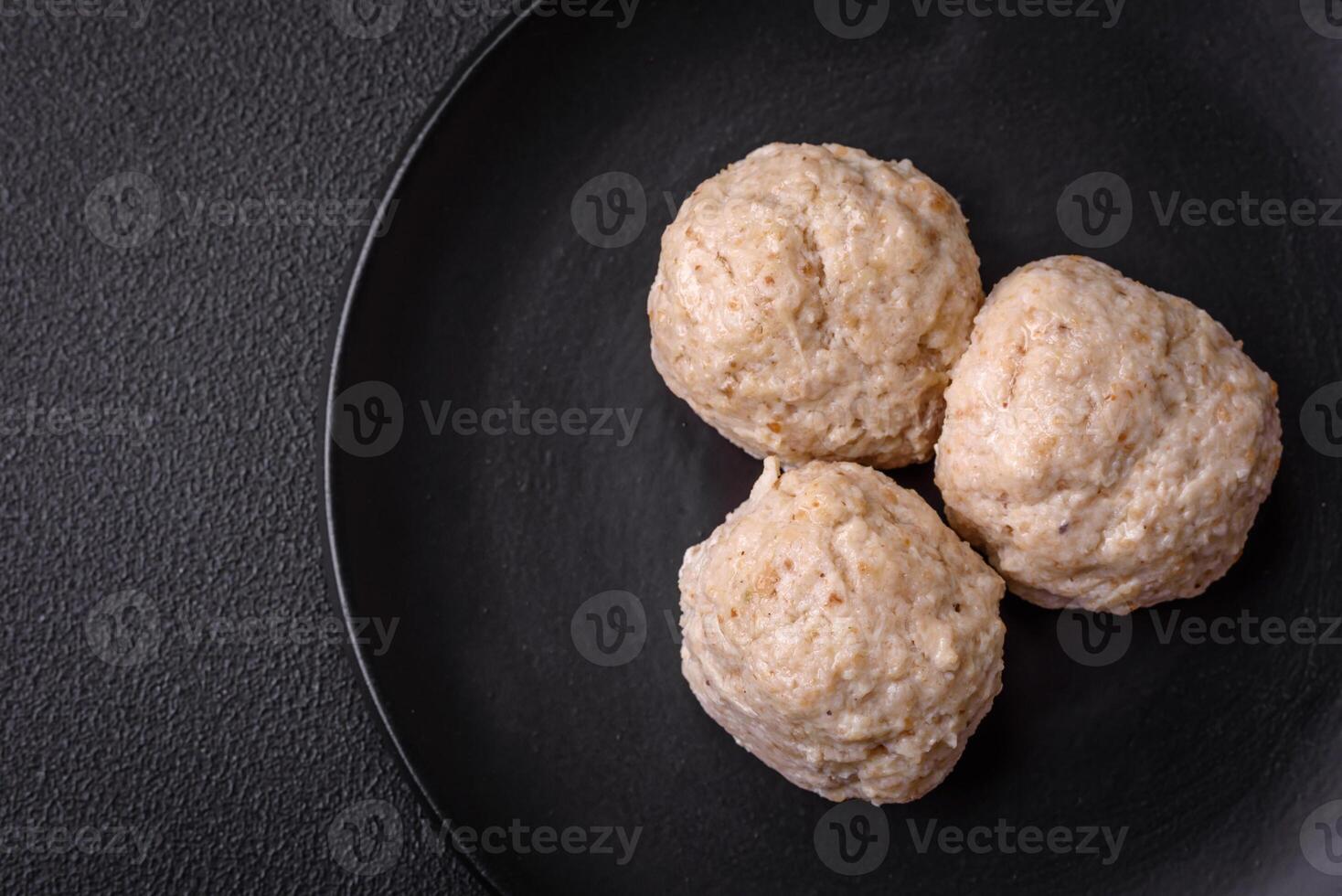 Delicious healthy steamed chicken cutlets or minced meatballs photo