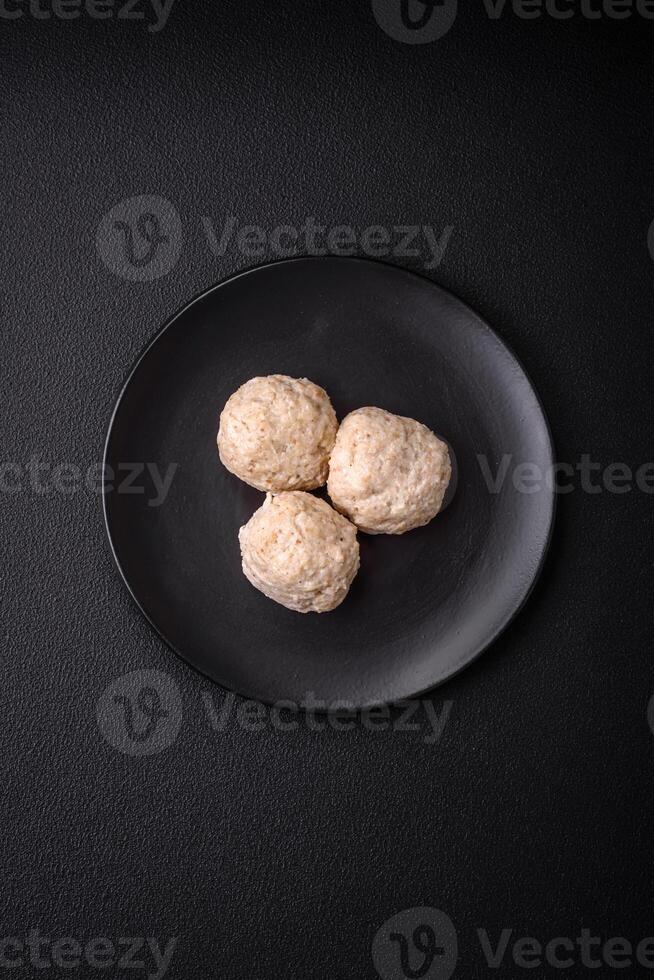 Delicious healthy steamed chicken cutlets or minced meatballs photo