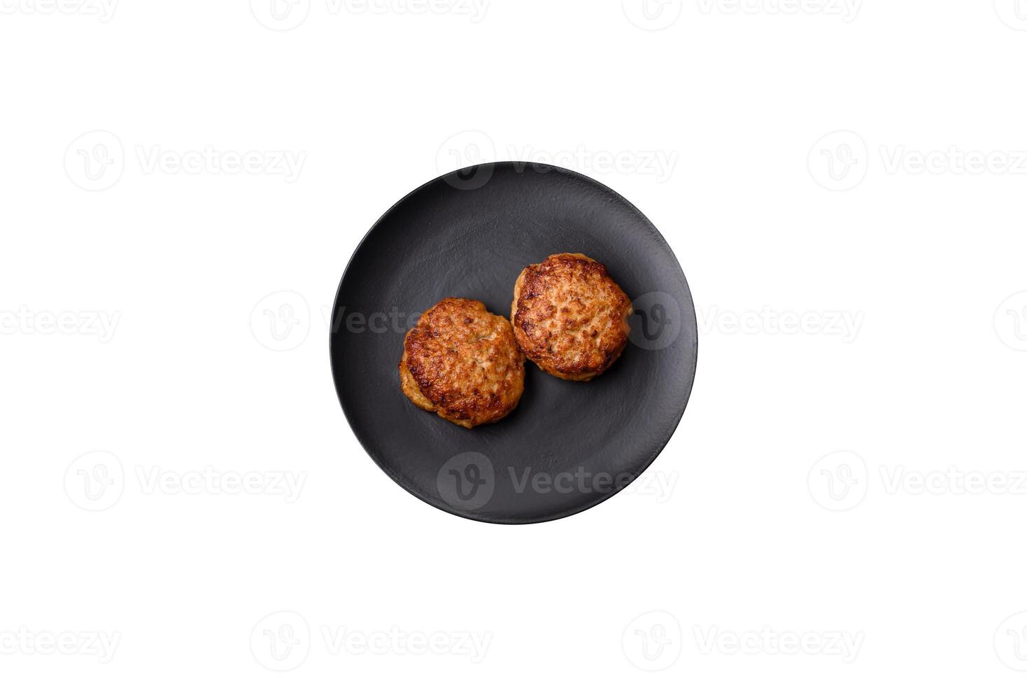 Delicious fresh fried minced fish cutlets with spices and herbs photo