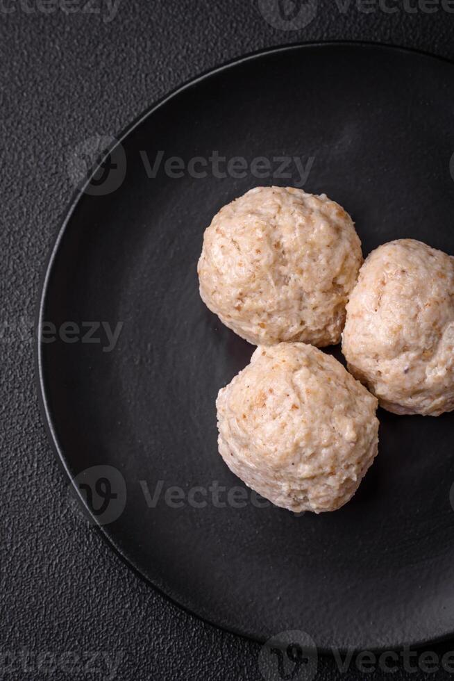 Delicious healthy steamed chicken cutlets or minced meatballs photo