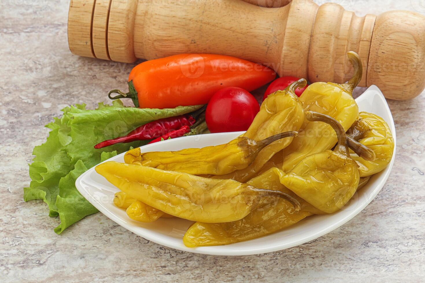 Pickled marinated spicy green pepper photo