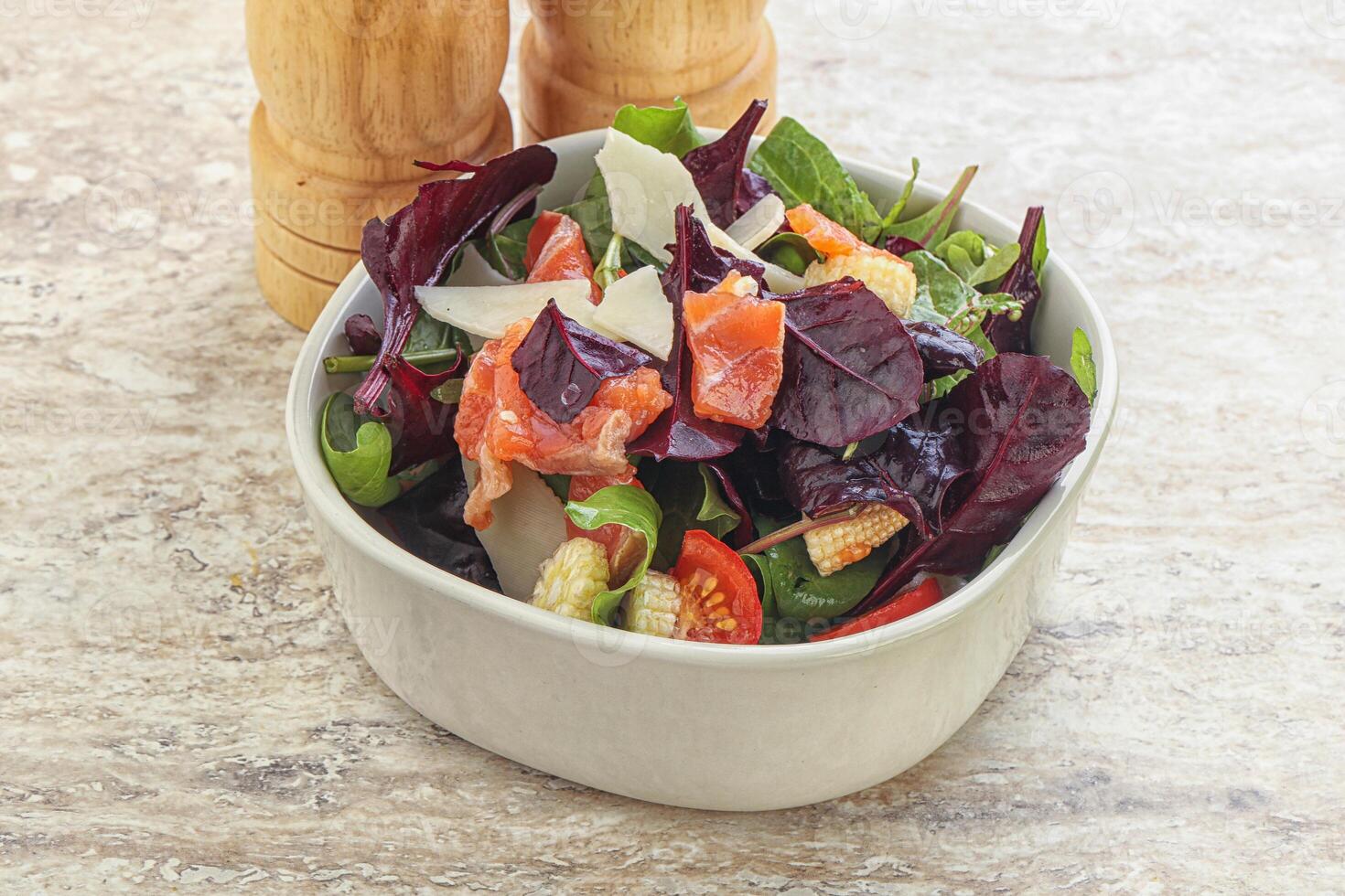 Mix salad with salmon, corn and tomato photo