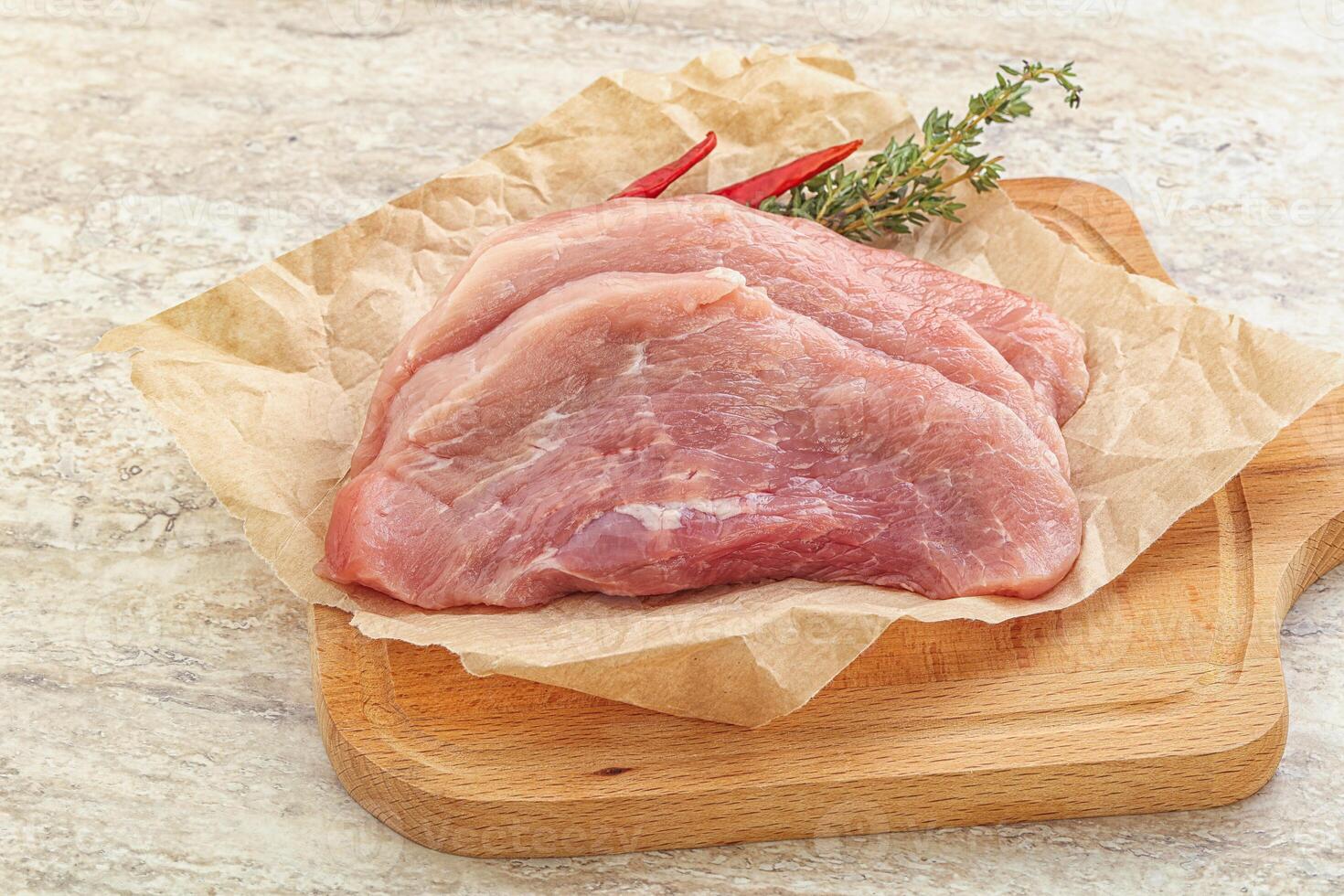 Raw pork schnitzel for roast photo