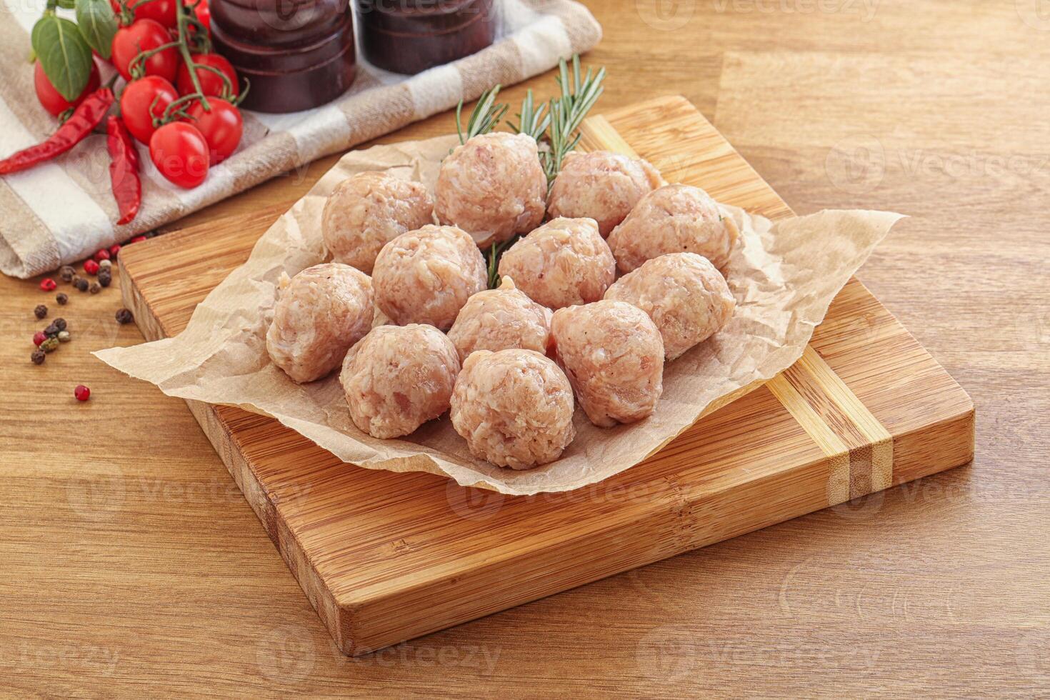 Raw chicken meatballs for cooking photo