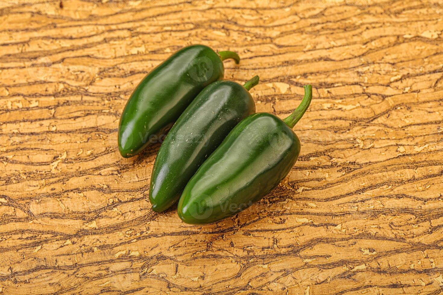 Green raw jalapeno peper heap photo