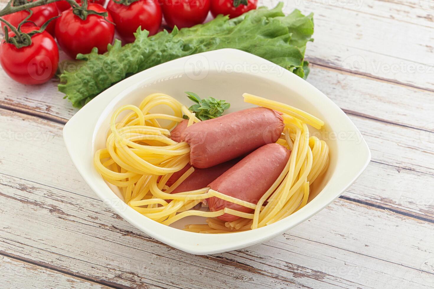 Mini sausages with pasta spaghetti photo