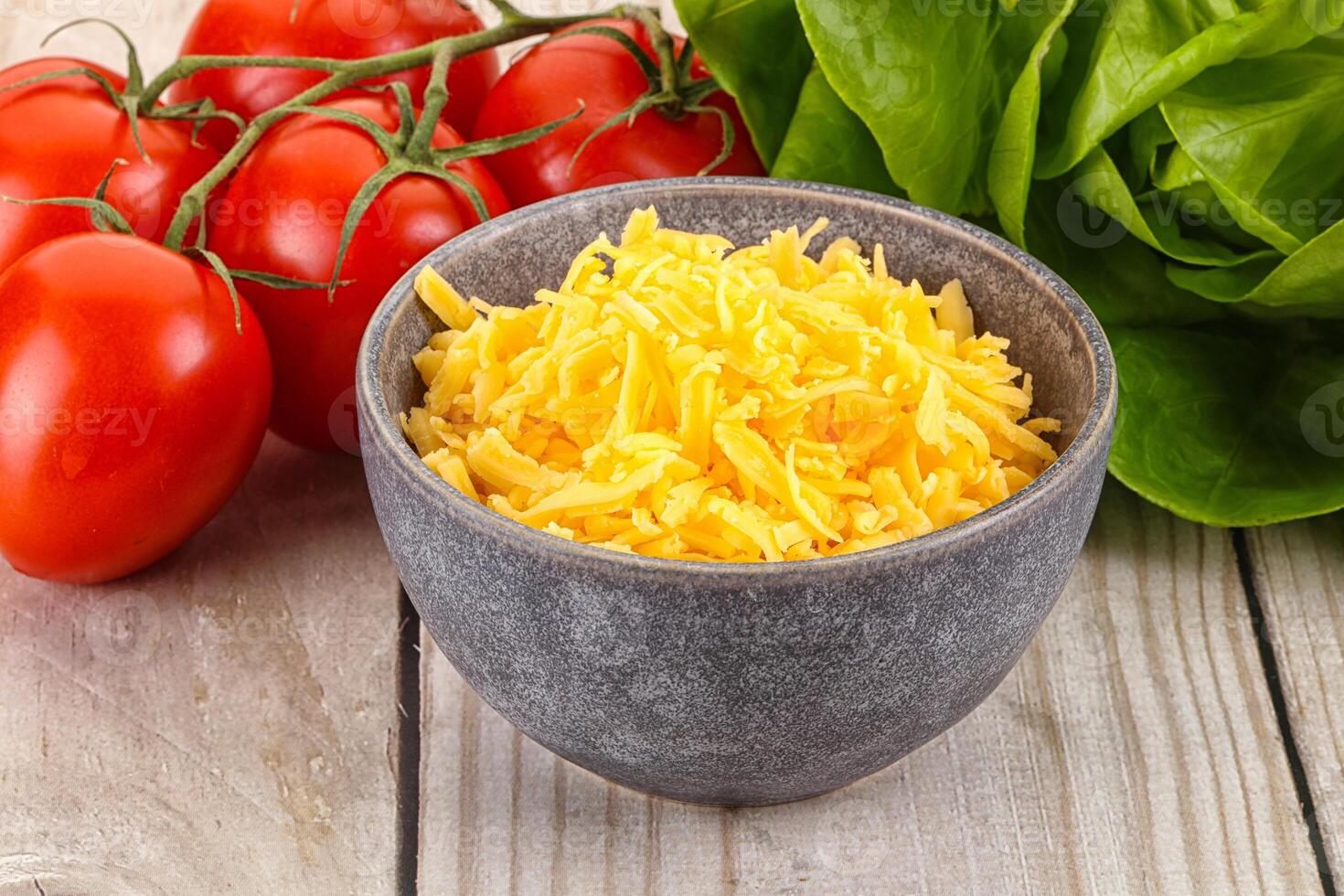 Shredded cheese in the bowl photo