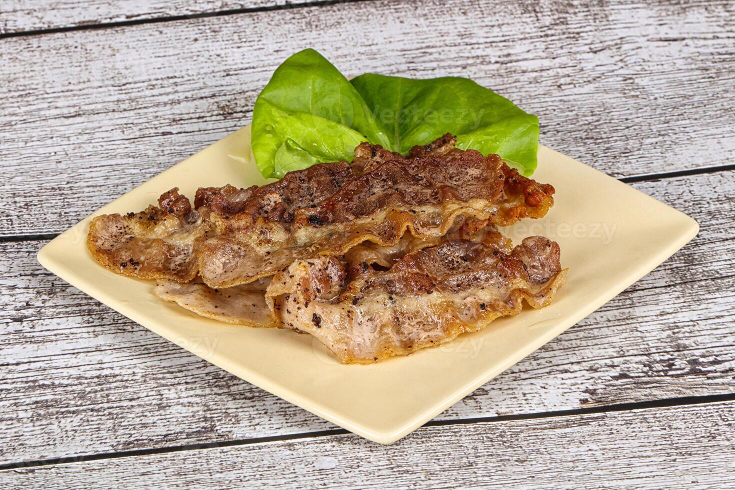 Roasted sliced pork fat bacon photo