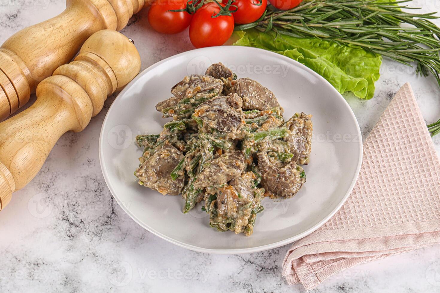 Fried turkey liver with herbs in cream sauce photo