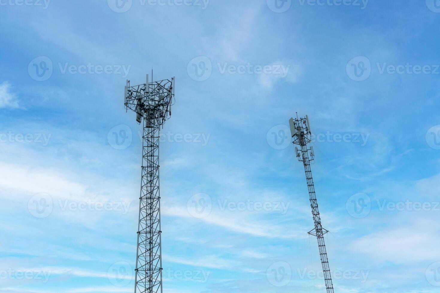 Internet signal tower or mobile phone signal tower isolated on blue sky background texture. Global communication and internet network connection concept photo