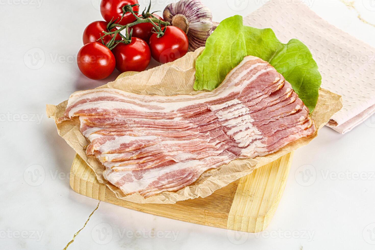 Sliced pork bacon oved board photo