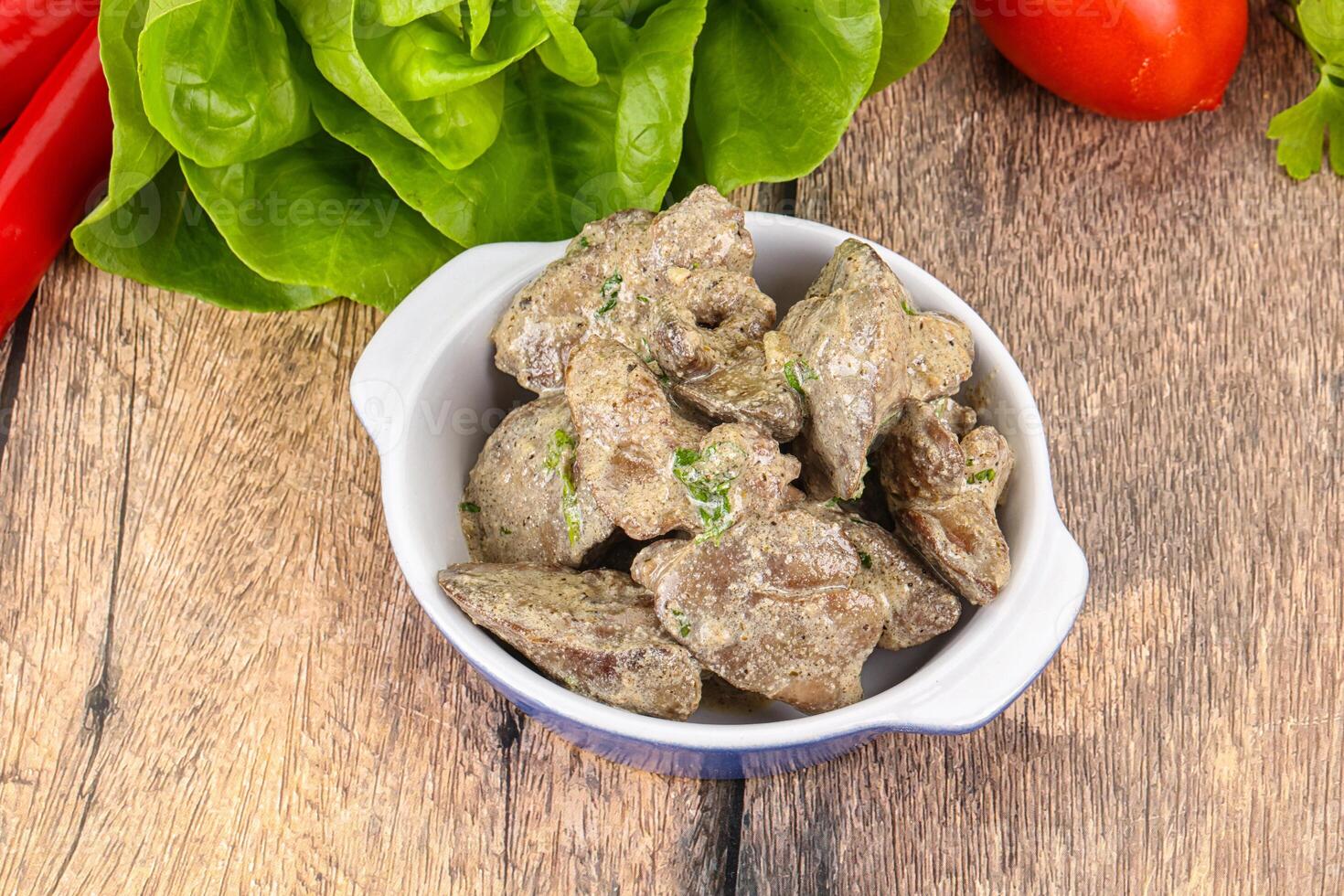 Chicken liver with cream sauce photo