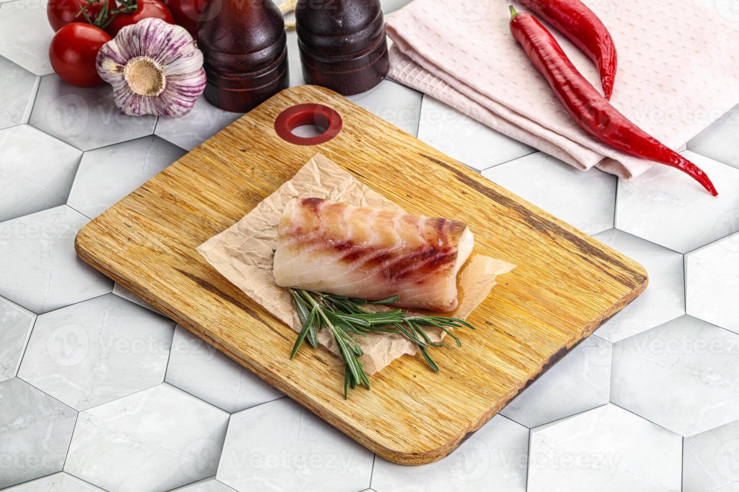 Raw cod fish steak for cooking photo