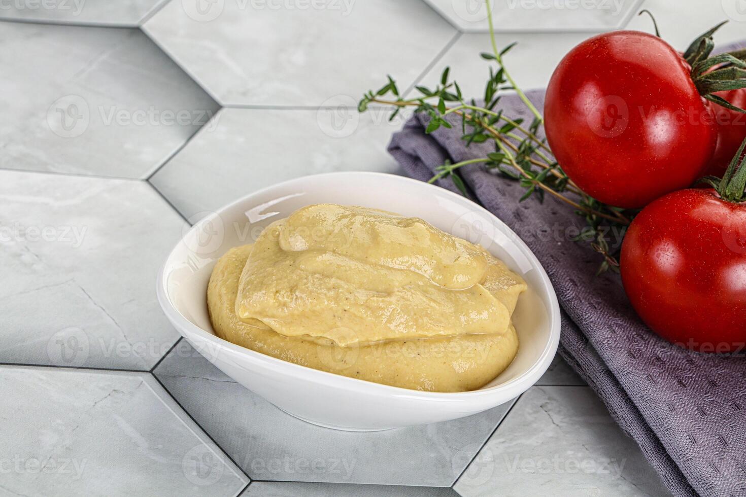 Dijon mustard sauce in the bowl photo