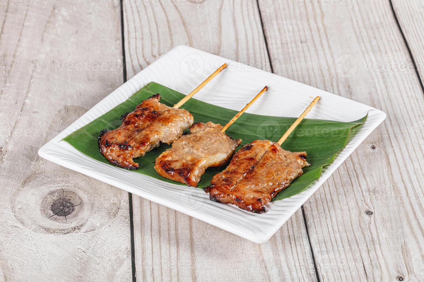 Thai cuisine - grilled pork skewer photo