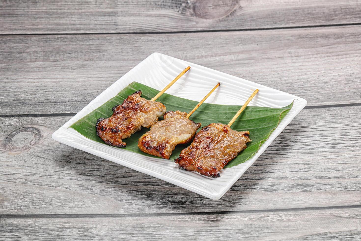 Thai cuisine - grilled pork skewer photo