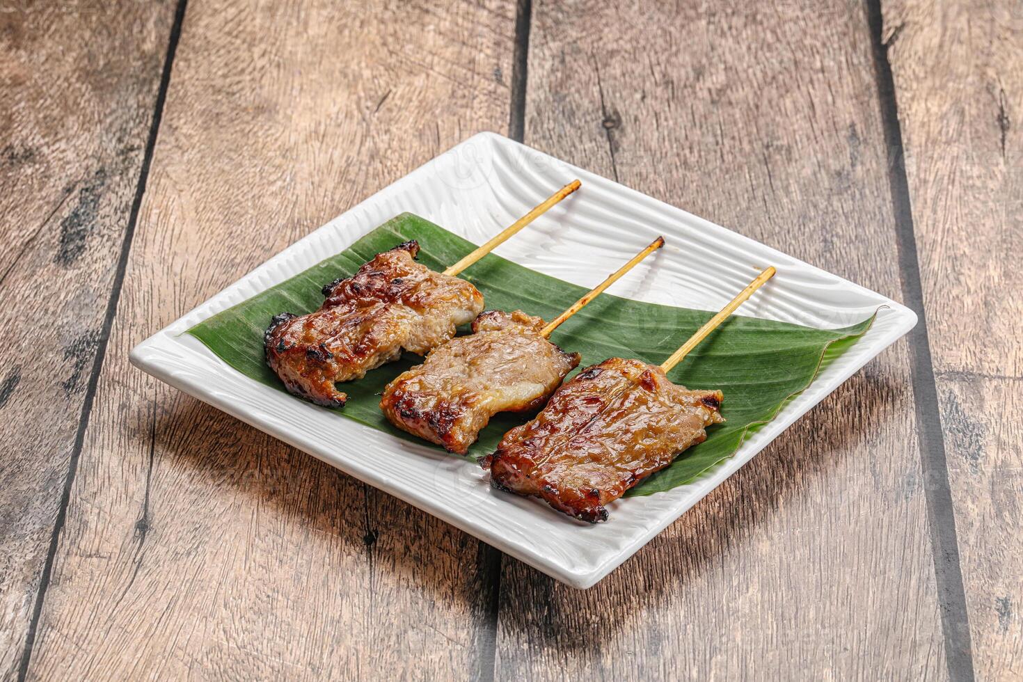 Thai cuisine - grilled pork skewer photo