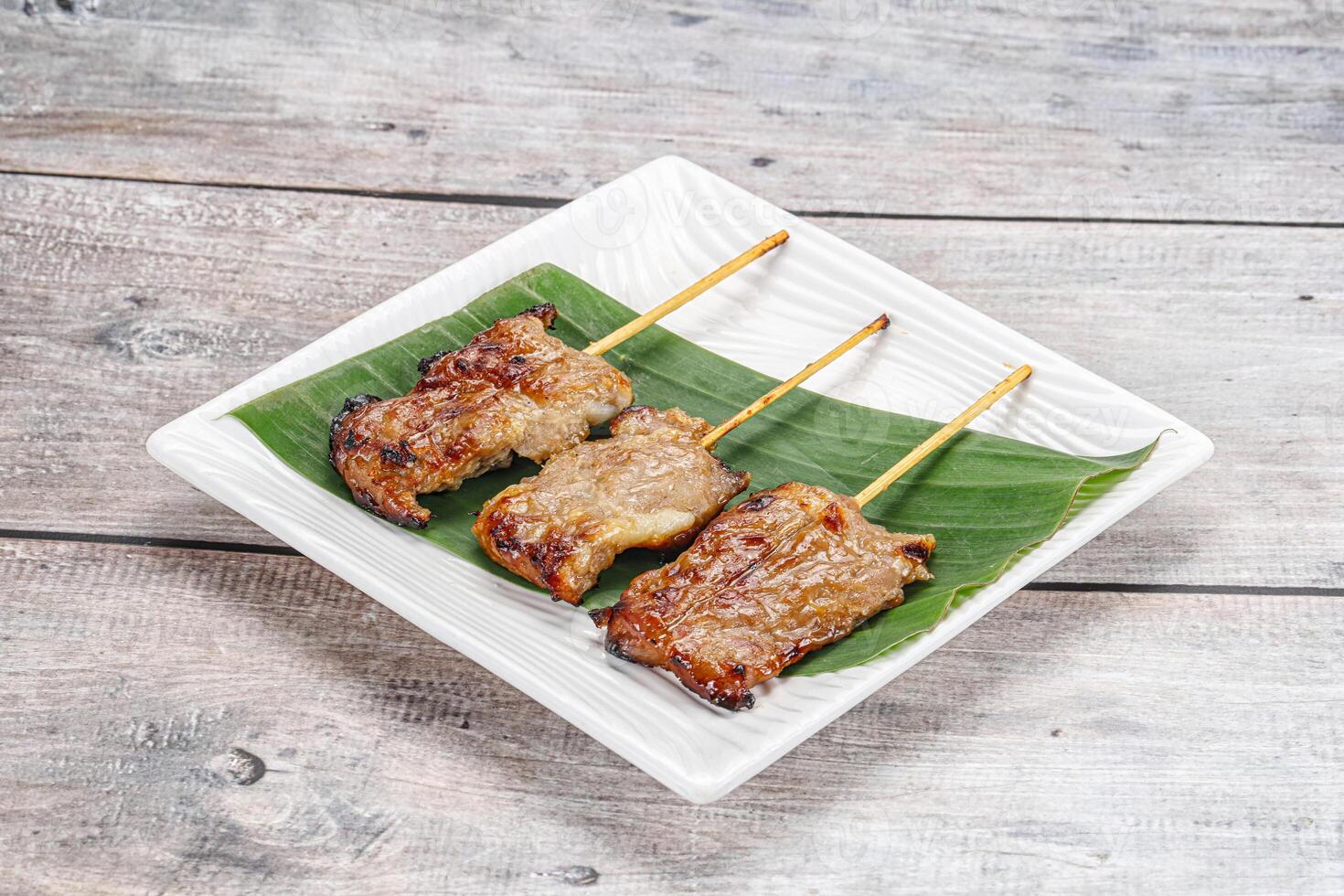 Thai cuisine - grilled pork skewer photo