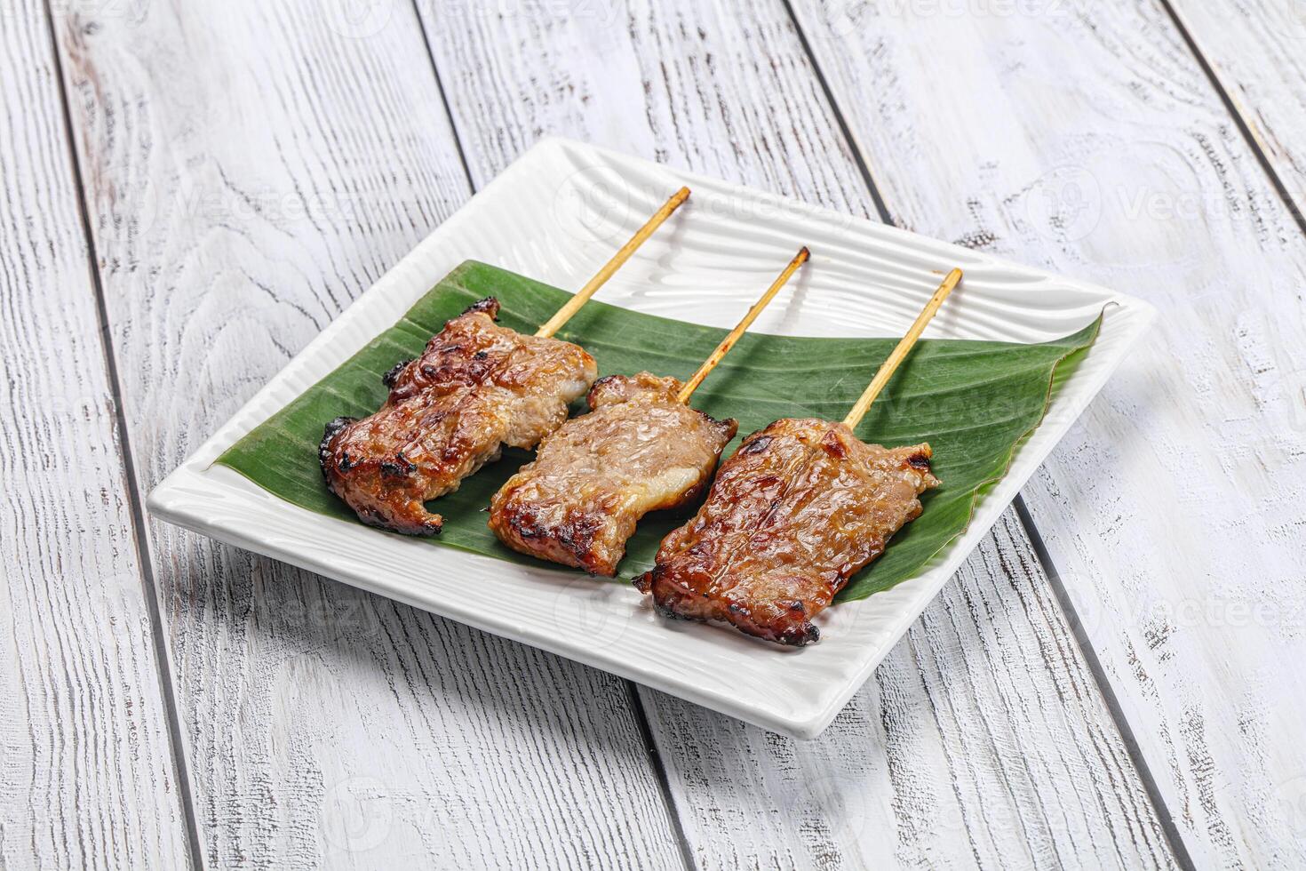 Thai cuisine - grilled pork skewer photo