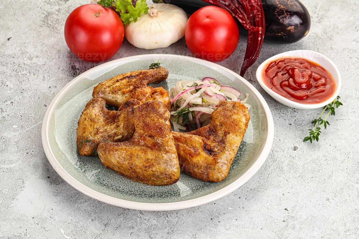 Grilled chicken wings with sauce photo