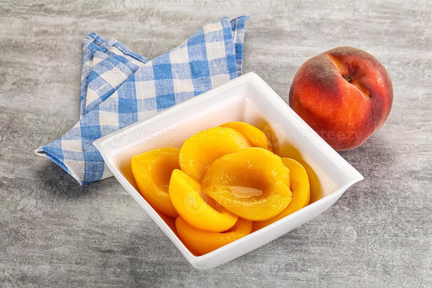 Ripe sweet and juicy canned peach photo