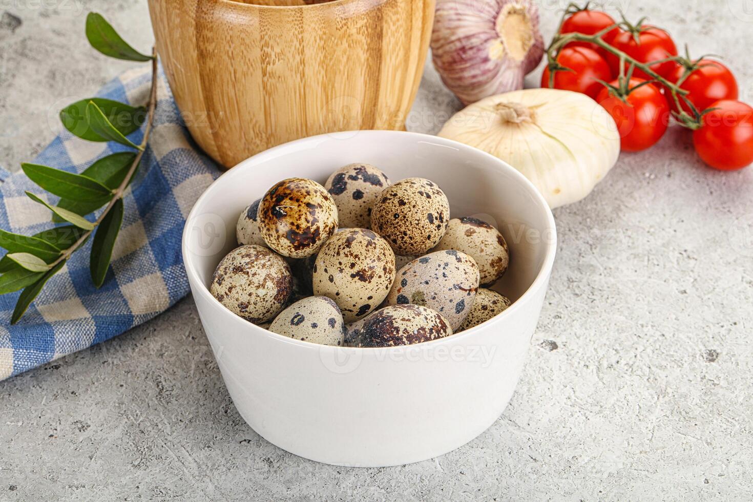 Raw quail eggs in the bowl photo