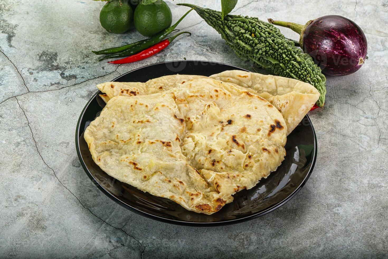 Indian tandori bread - naan with cheese photo