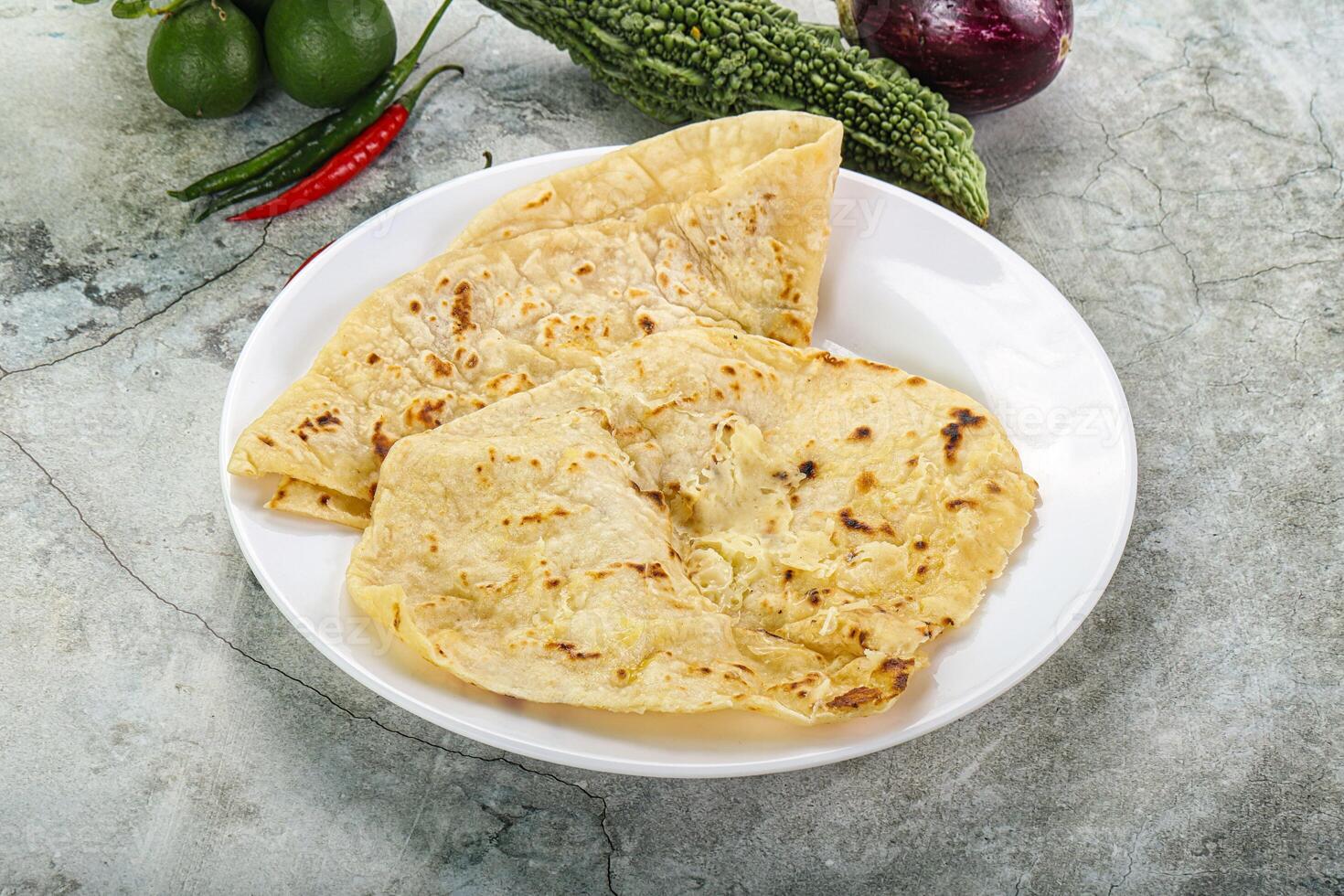 Indian tandori bread - naan with cheese photo