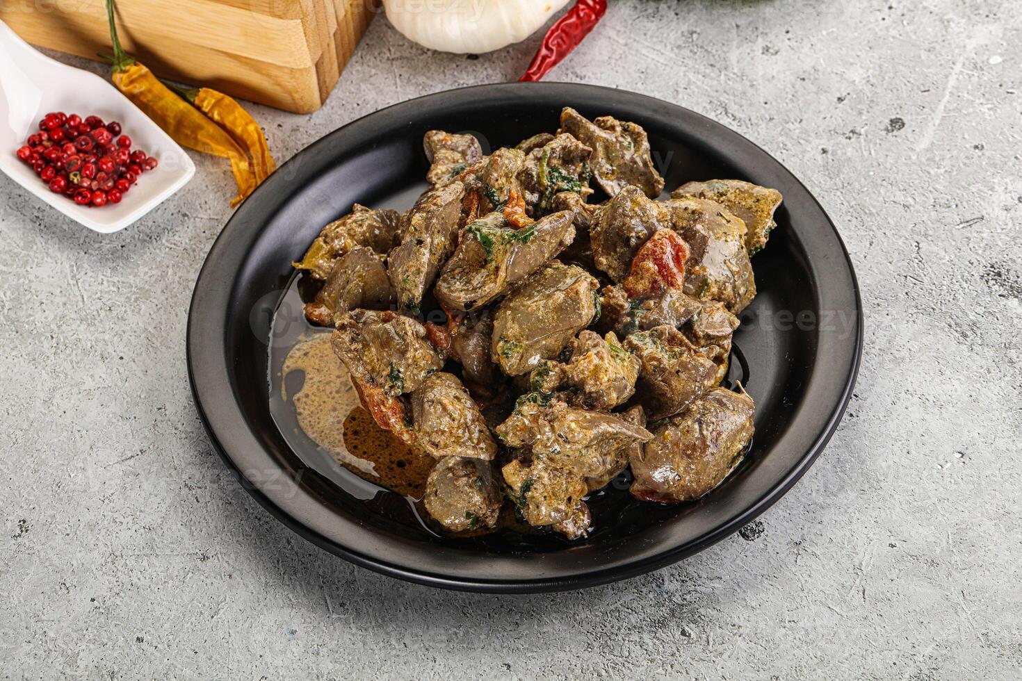 Chicken liver in cream sauce photo