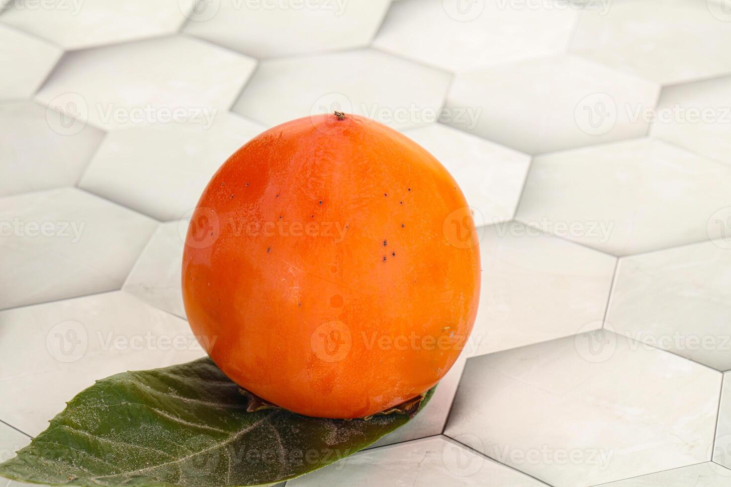 Fresh ripe sweet juicy persimmon photo