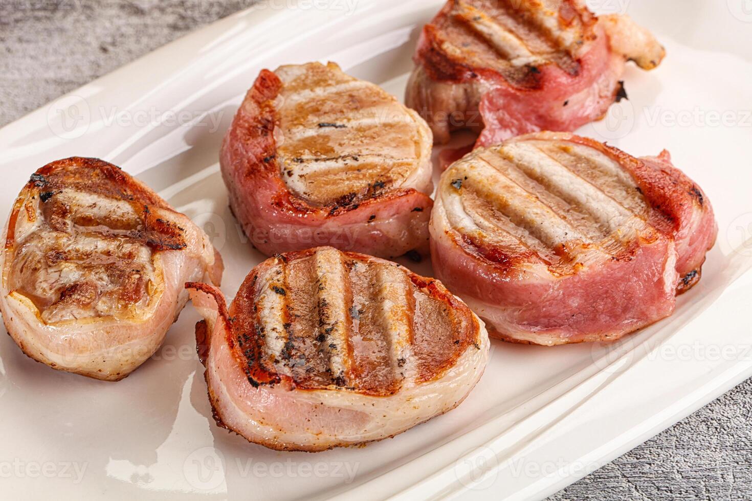 Grilled pork tenderloin with bacon photo