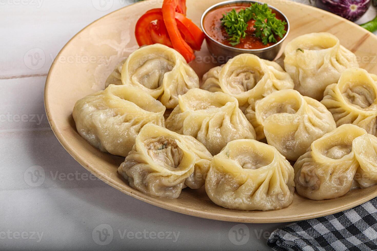 Steamed Nepali dumpling Momo with sauce photo