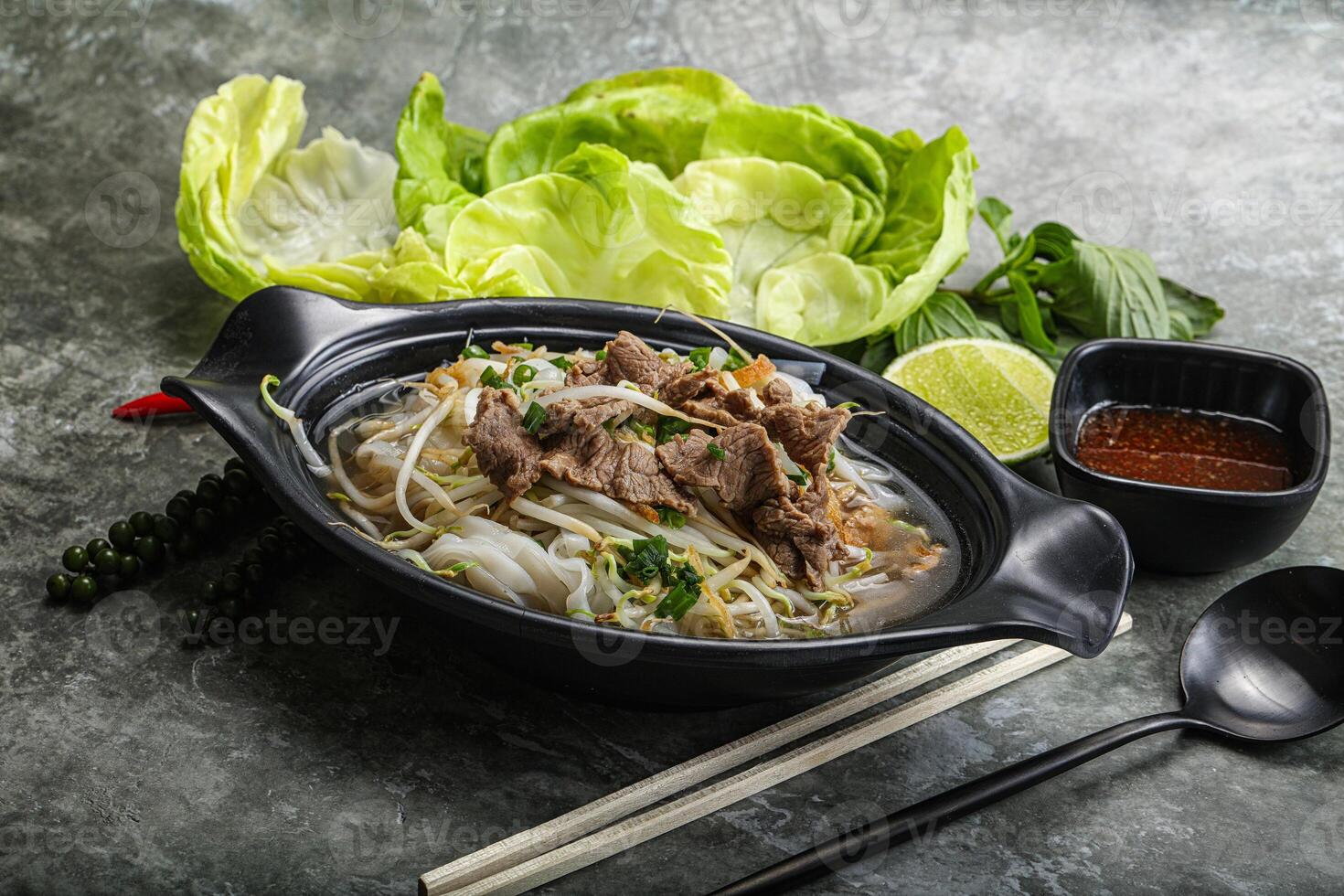 Vietnamese traditional soup Pho Bo with beef photo