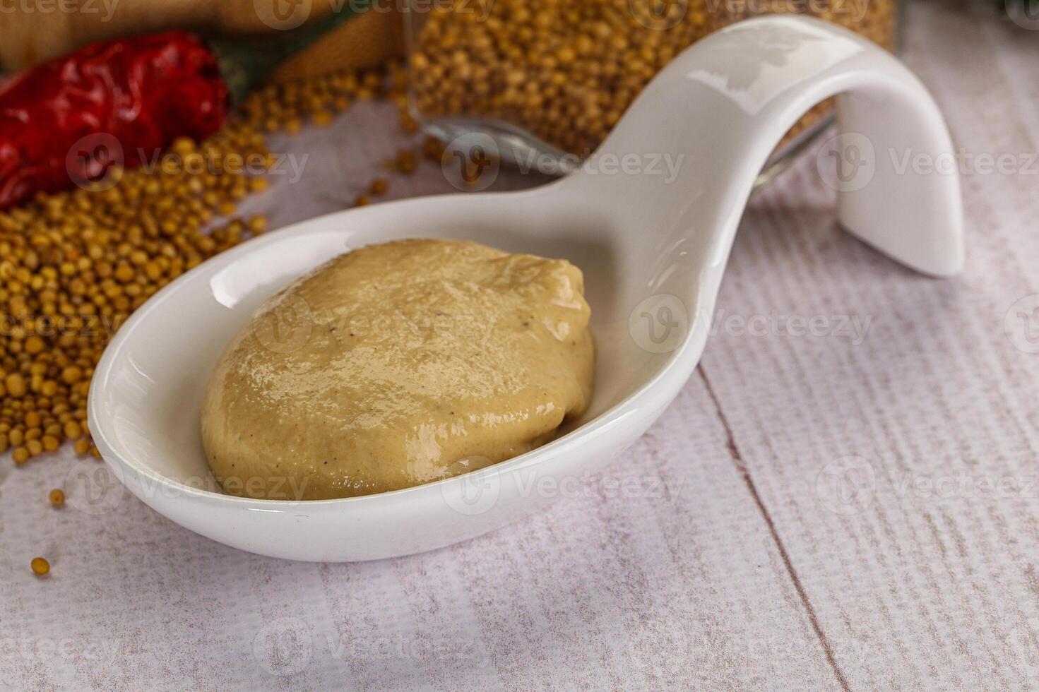 Dijon mustard sauce in the bowl photo