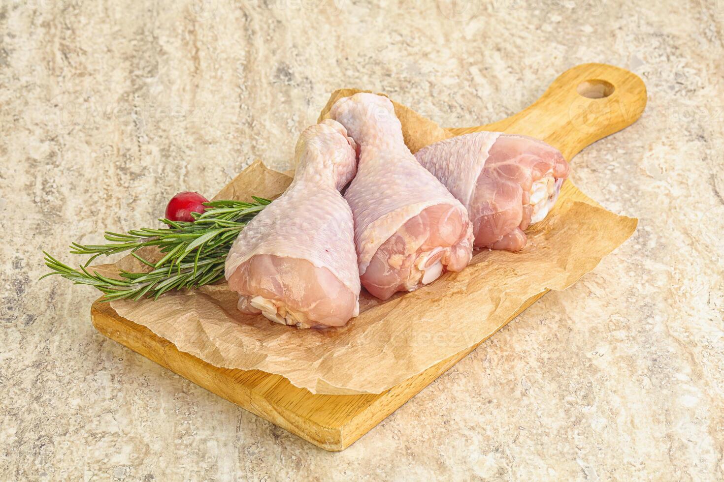 Raw chicken leg Drumstick for cooking photo