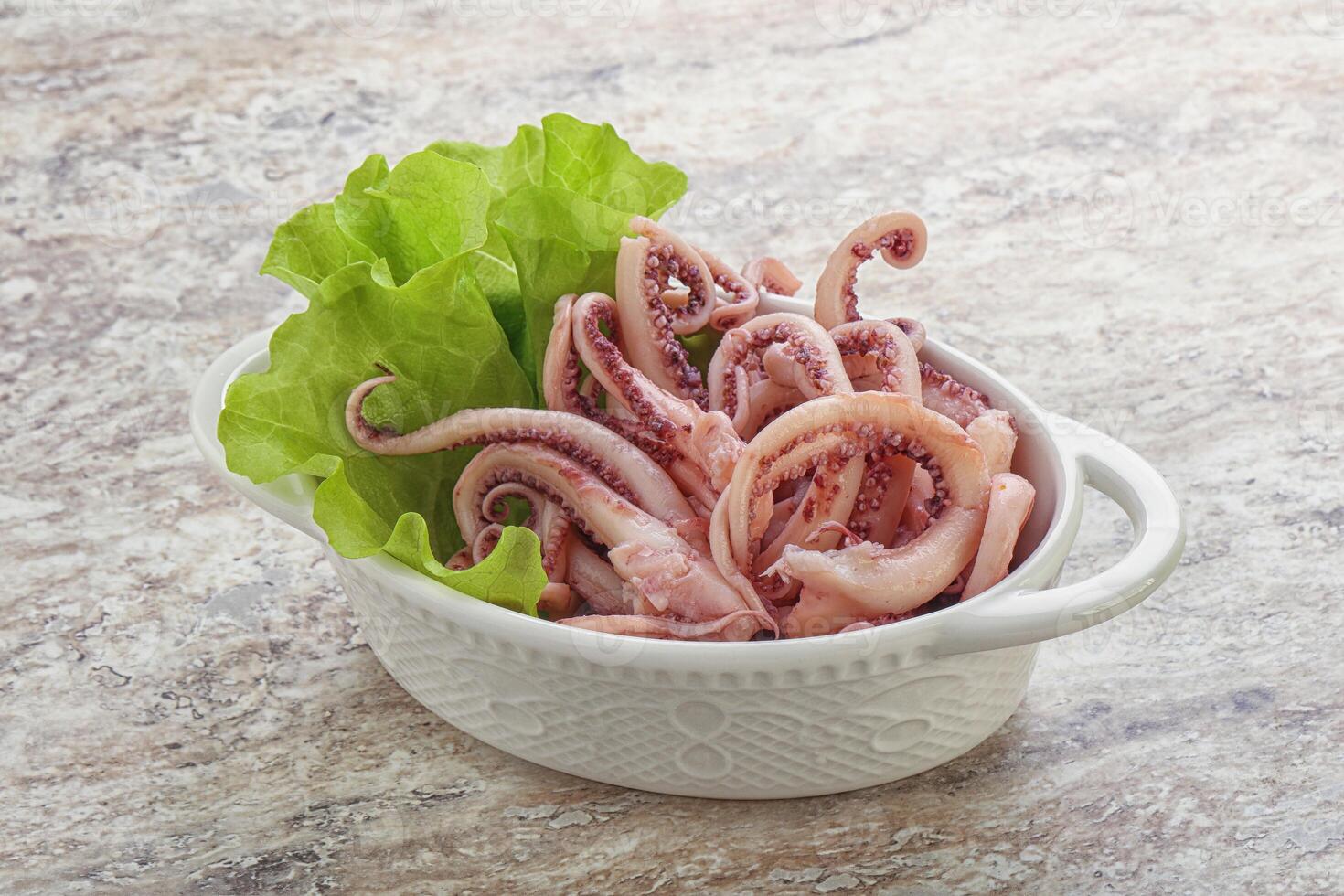 Marinated squid tentacles in the bowl photo