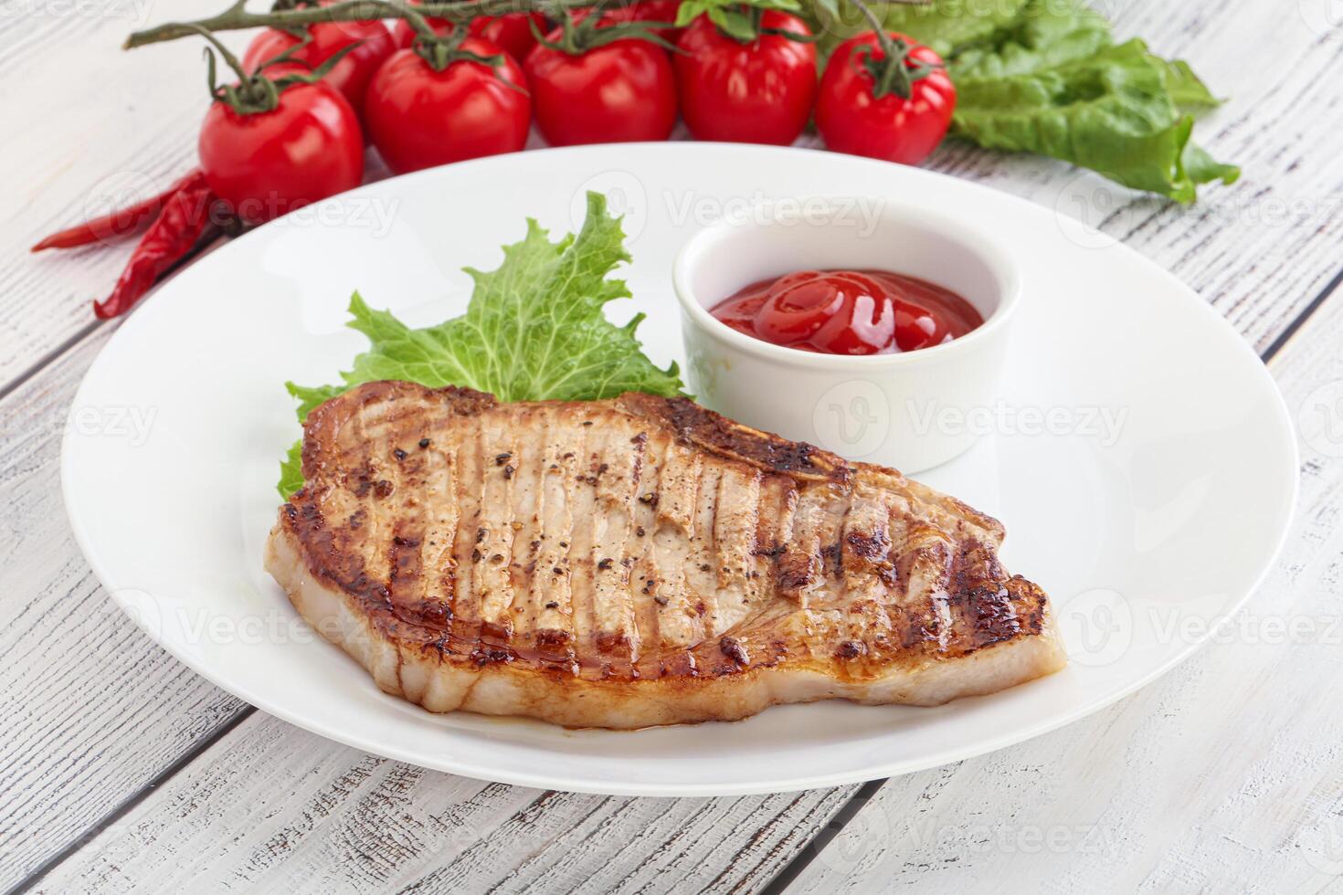 Grilled pork steak with ketchup photo