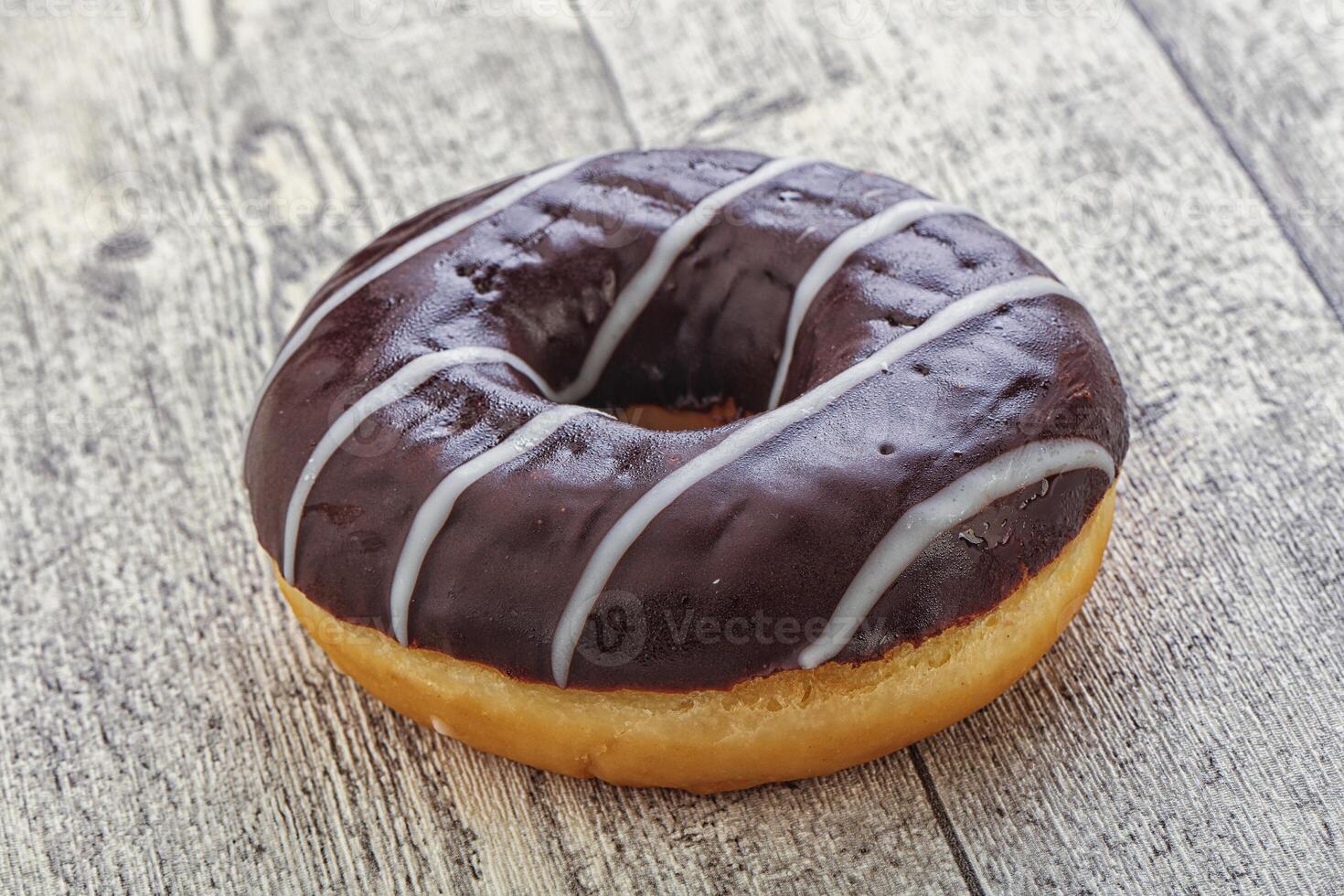 Glazed sweet tasty chocolate donut photo