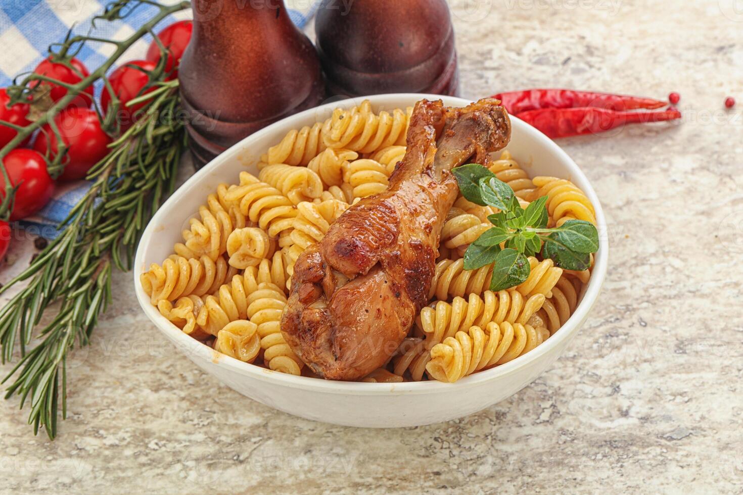 Roasted chicken leg with macaroni photo