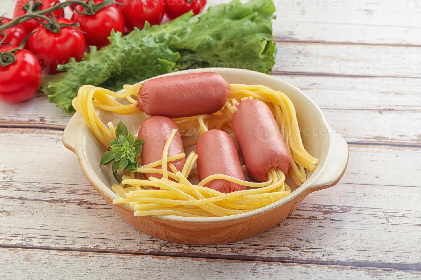 Mini sausages with pasta spaghetti photo