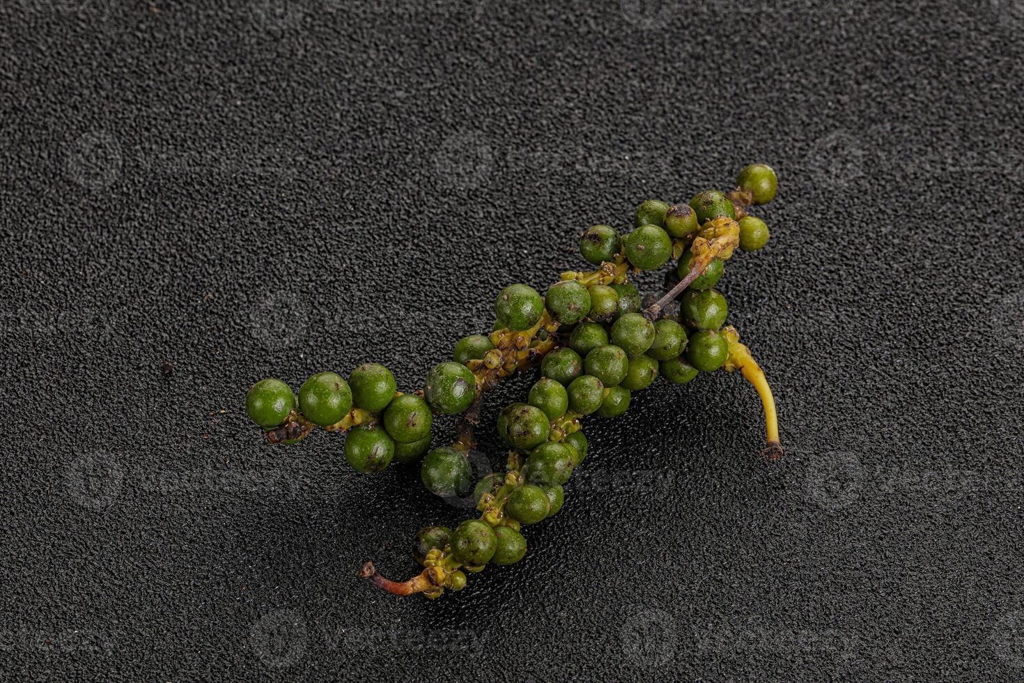 Green pepper corn heap isolated photo