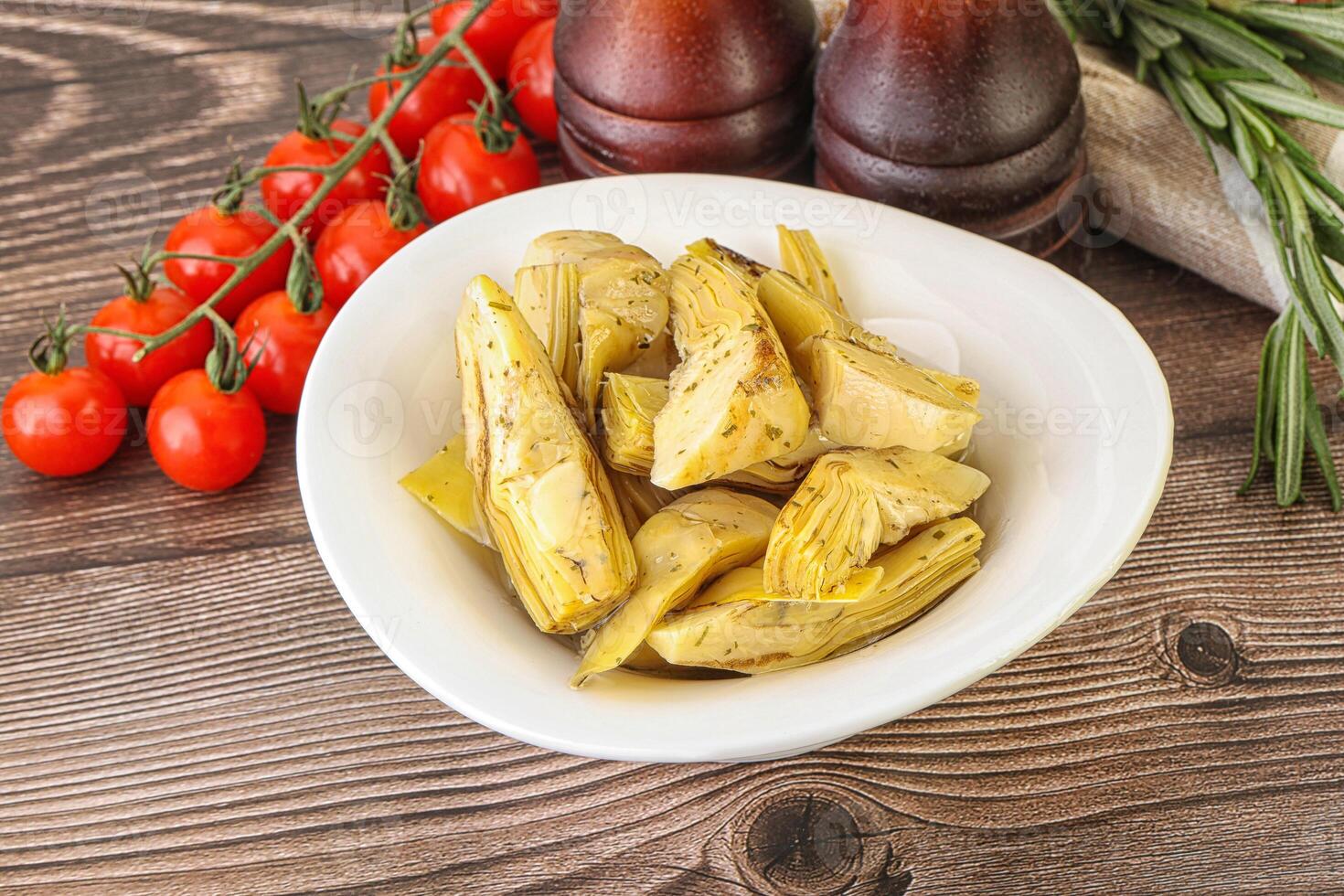 Grilled artichoke marinated in oil photo