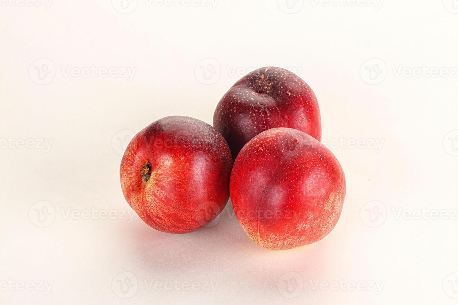 Ripe sweet juicy nectarines heap photo