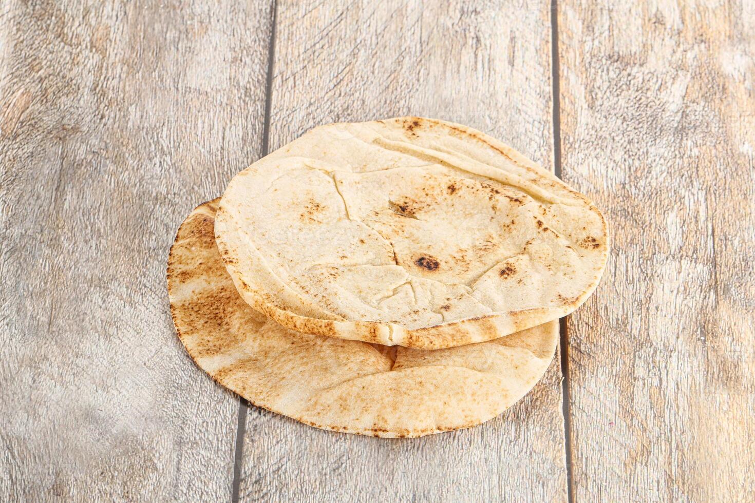 Traditional eastern round pita bread photo